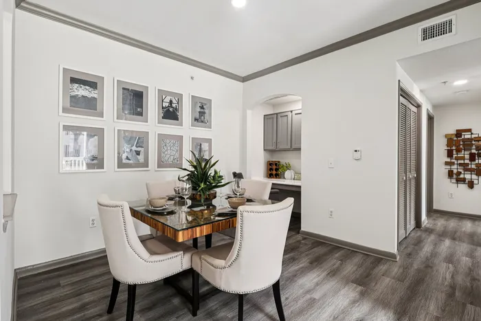 dining room with lighting, a table, and chairs