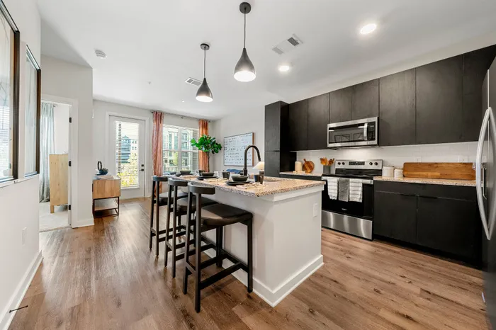 Spacious kitchen with stainless steel appliances and island