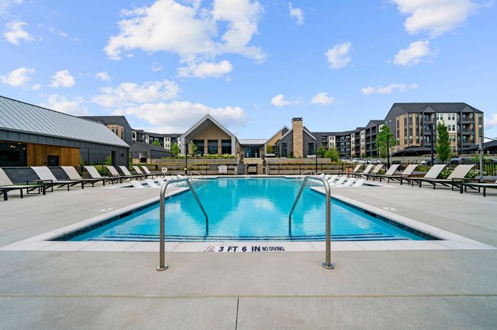 resort style pool and lounge seating