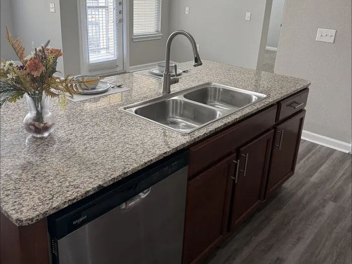 sink and dishwasher on the kitchen island