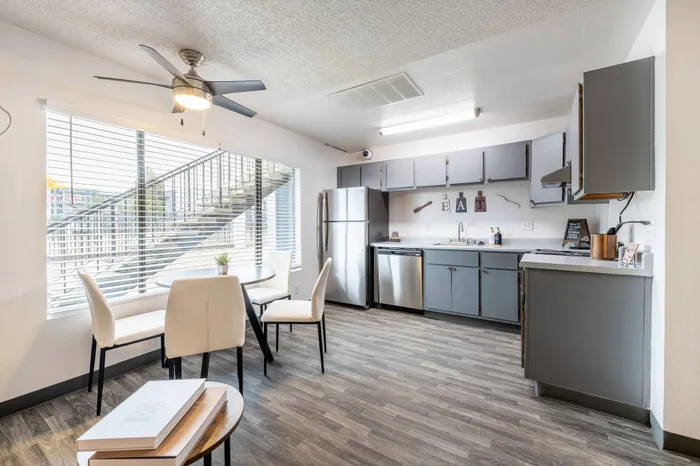 open kitchen in unity with stainless steel appliances