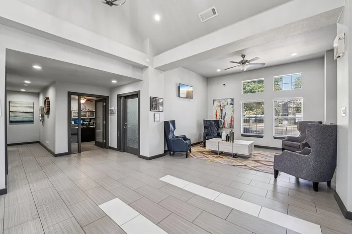 Modern leasing office exterior with clean landscaping and inviting entryway in a Waco, TX apartment community.