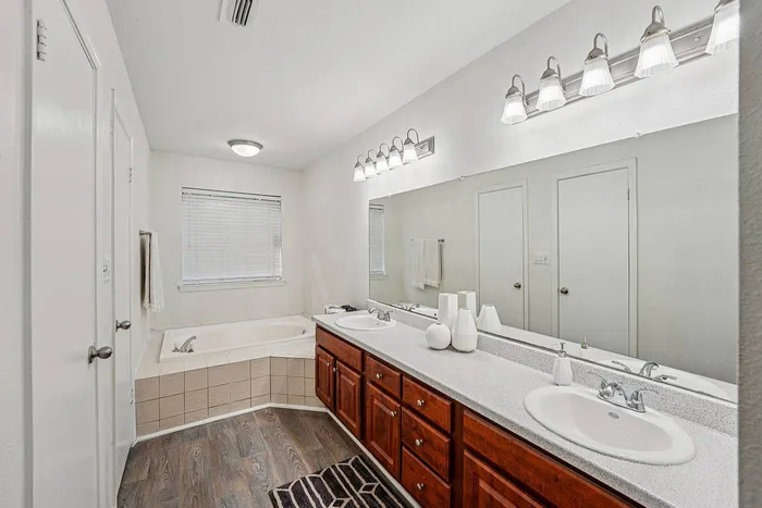 Modern bathroom with granite countertops and sleek finishes at Avenues of Kennesaw