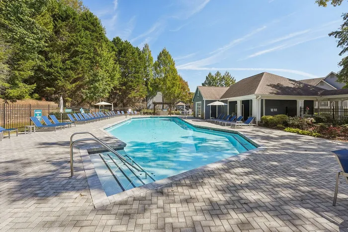 Resort-style swimming pool with lounge chairs at Avenues of Kennesaw in Georgia