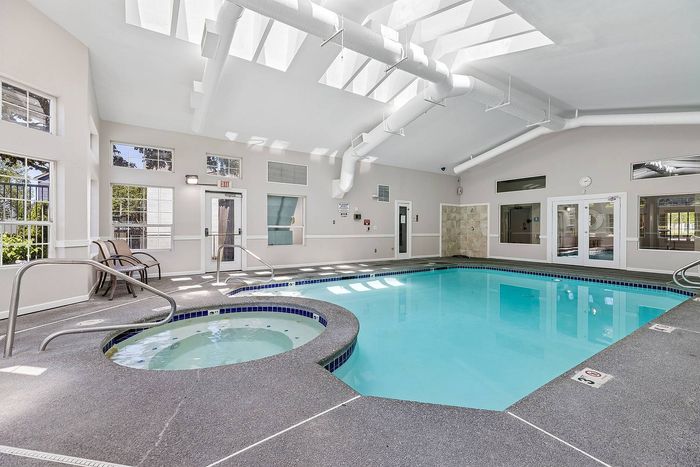 sparkling indoor pool with hot tub
