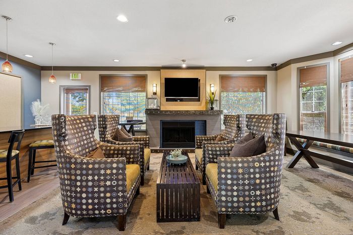 stylish clubhouse with fireplace and entertainment system