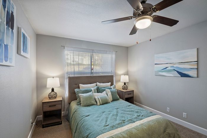 large bedroom with ceiling fan