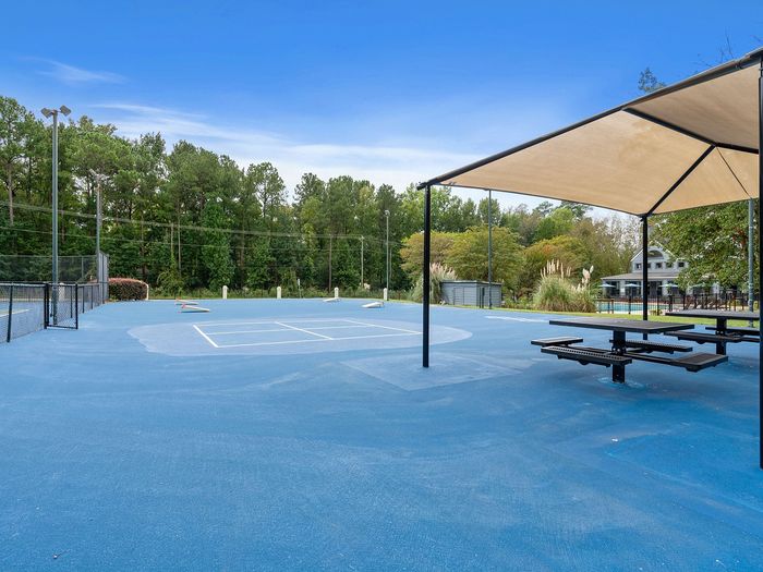 cornhole and tennis courts