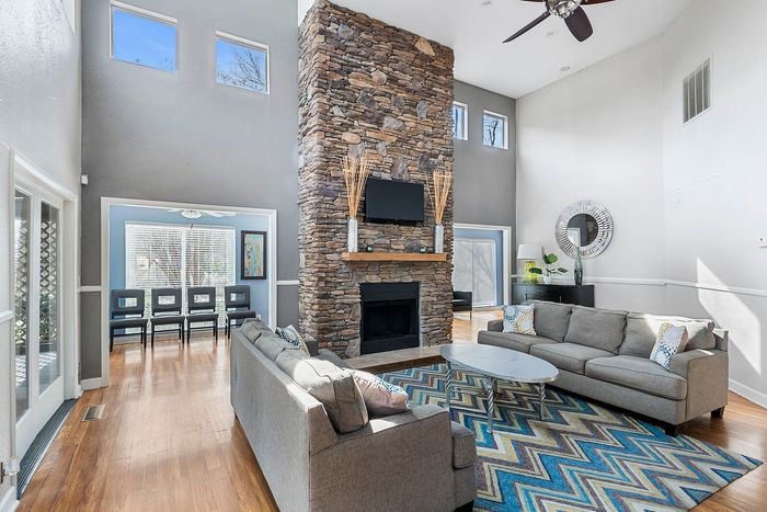 stylish clubhouse with fireplace and tv