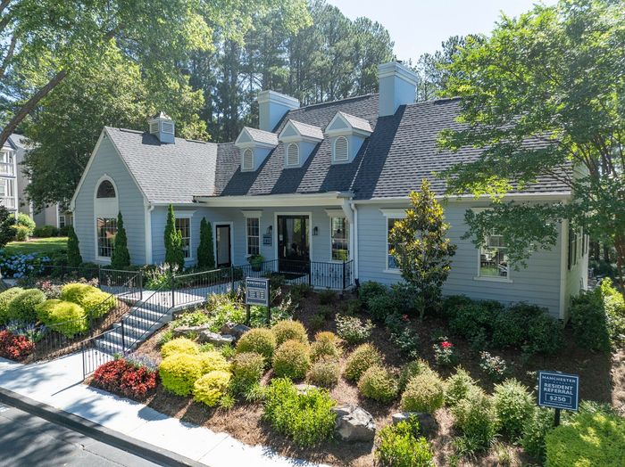 Front of the leasing office with beautiful landscaping