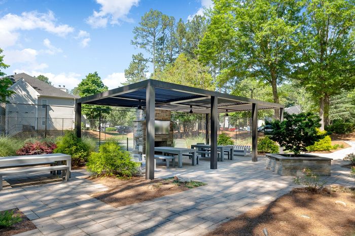 sun deck with beautiful landscaping