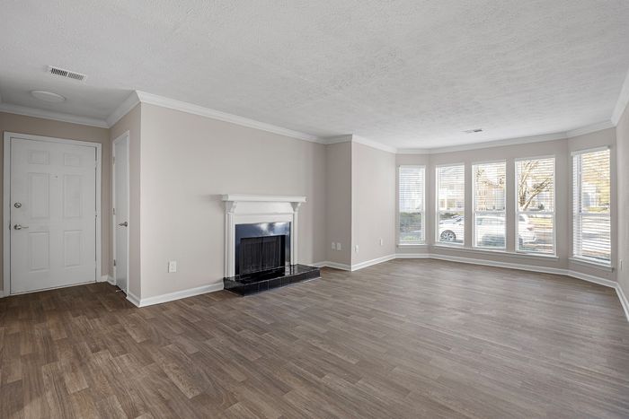 fireplace and bay windows in living room