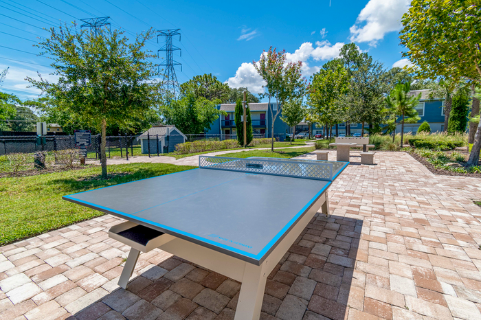 exterior ping pong table, stone ground, green teas