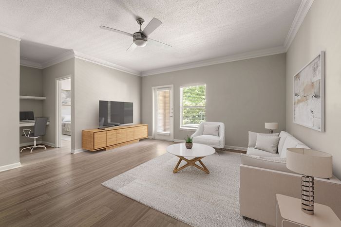 Bright and modern living room with stylish furniture, sleek wooden floors, and large windows enhancing natural light.