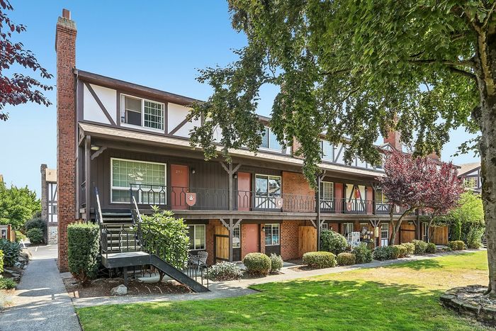 Beautiful landscaping and brick apartment buildings