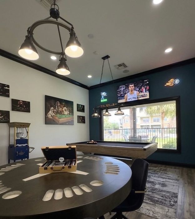 spacious game room with chips and billiards