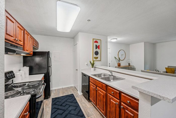 Gourmet kitchen with upgraded appliances and custom cabinetry in Avenues of Kennesaw luxury apartments