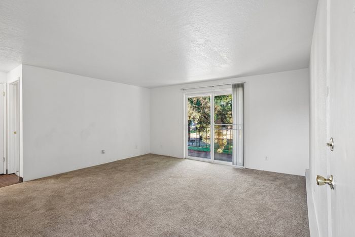 Modern living room at Fox Pointe Apartments in Portland, OR with natural light and open layout