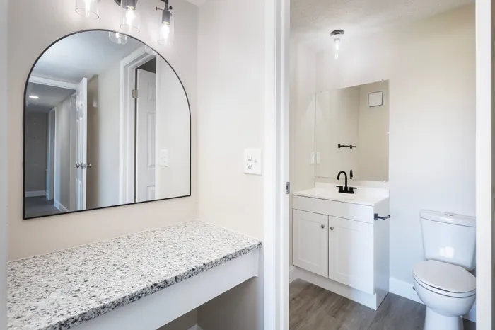 Fully Renovated Bathroom w/ Vanity and contemporary lighting.