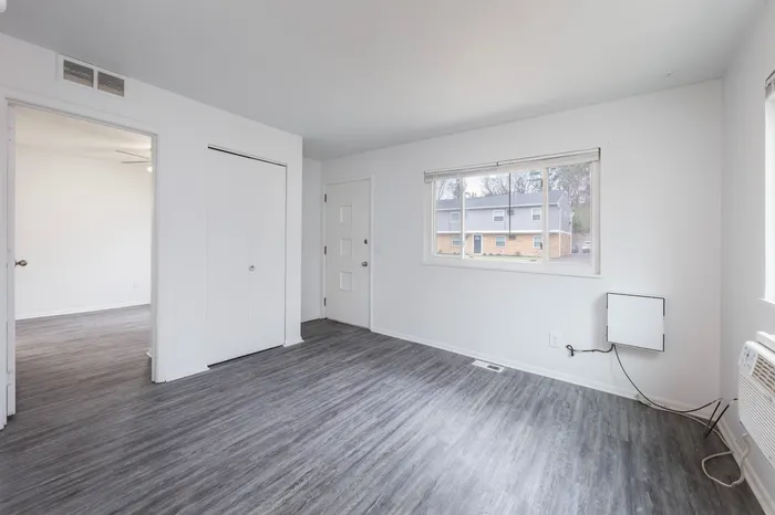 Spacious Bedroom with large window and en suite closet.