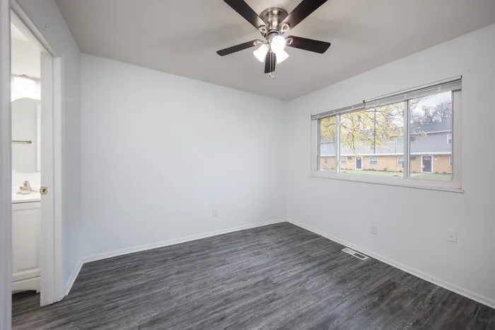 Spacious Bedroom with large window and en suite bedroom.