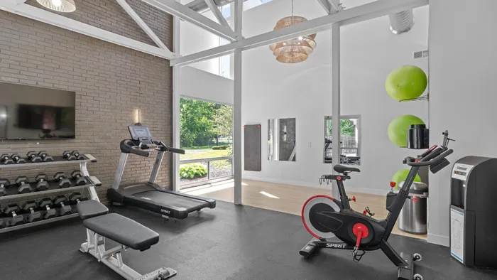 Spacious fitness center with state-of-the-art equipment, free weights, treadmills, and floor to ceiling windows allowing natural light in. Explore pet-friendly studio, one-, and two-bedroom apartments in Cincinnati, OH. The Alcove offers upscale living with premium amenities near downtown. apartments for rent in Cincinnati OH, Cincinnati luxury apartments, pet-friendly apartments in Cincinnati, downtown Cincinnati apartments, one bedroom apartments Cincinnati, The Alcove Apartments Cincinnati