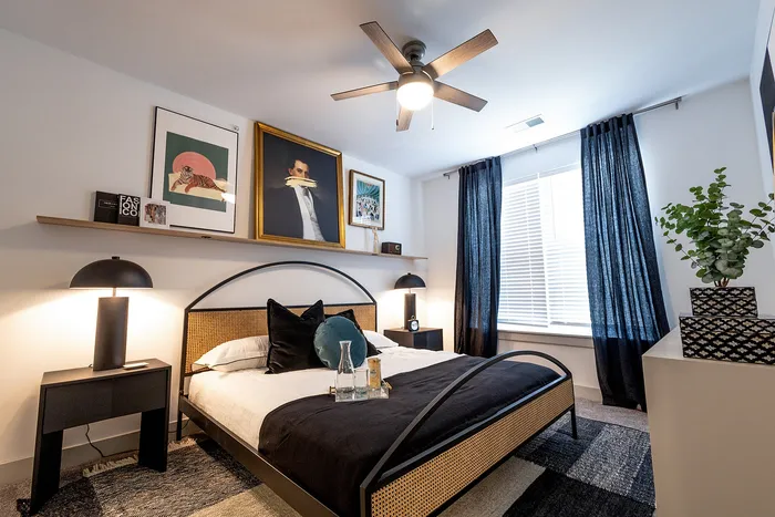 Elegantly designed bedroom featuring modern decor, stylish artwork, and cozy lighting with a soothing ambiance.