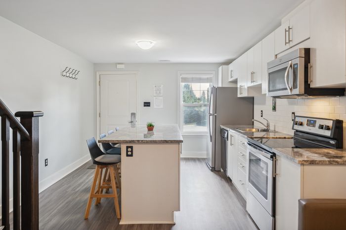 Kitchen with view of front entrance
