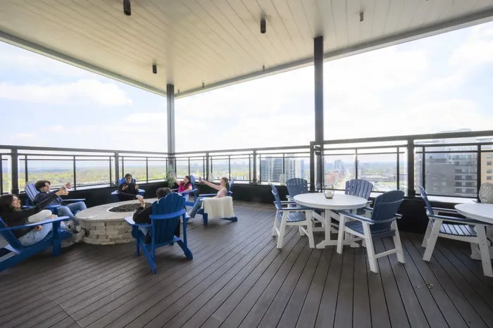 Vibrant rooftop terrace with comfortable seating, scenic city views, and modern furnishings perfect for social gatherings.
