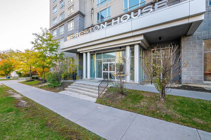 Elegant entrance of Preston House with modern architecture and lush greenery, offering a welcoming and serene living environment.