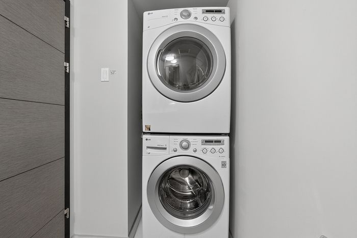 Modern stacked washer and dryer in a sleek laundry nook, perfect for maximizing space and convenience.