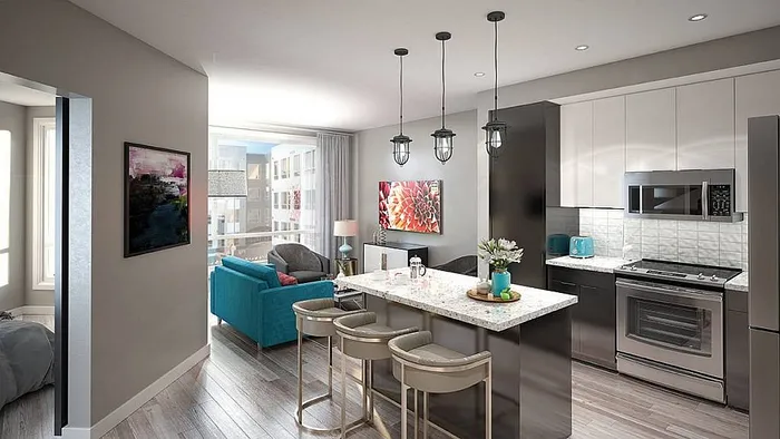 Modern open-concept kitchen and living area with sleek countertops, contemporary lighting, and vibrant decor.