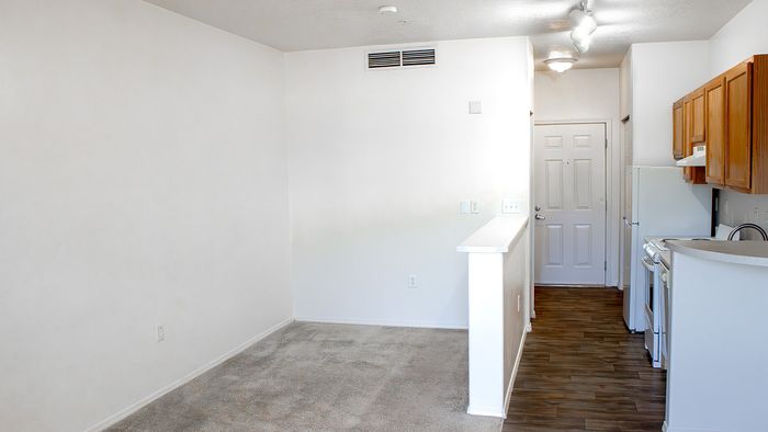 Open-concept Metro Flats studio apartment with kitchen, breakfast bar, and entry area