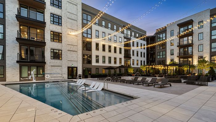 Sugar Alley rooftop pool deck with fire features and seating, viewed at an angle
