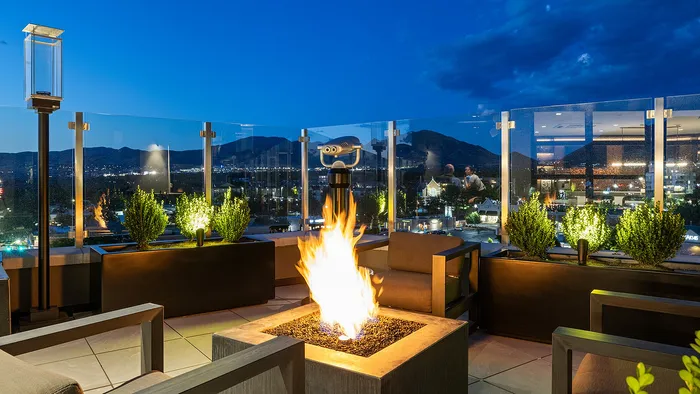 Sugar Alley 8th floor rooftop deck with city and mountain views at sunset