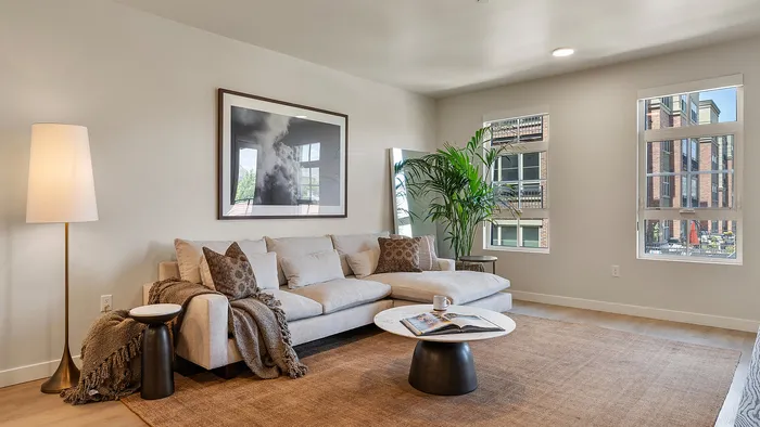 Jade apartment living room with sofa, coffee table, and open design