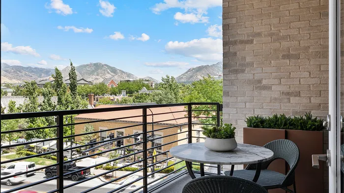 Balcony of Jade one-bedroom apartment with railing and outdoor view