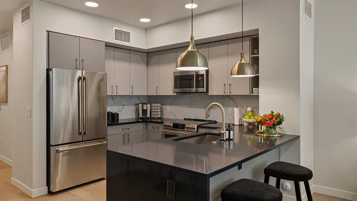 Studio kitchen in Slate unit with modern appliances and open shelving