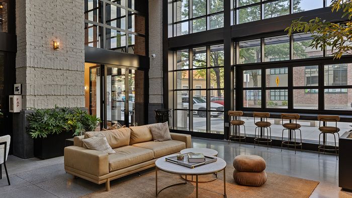 Glass Atrium Lounge at Sugar Alley – glass atrium with couch