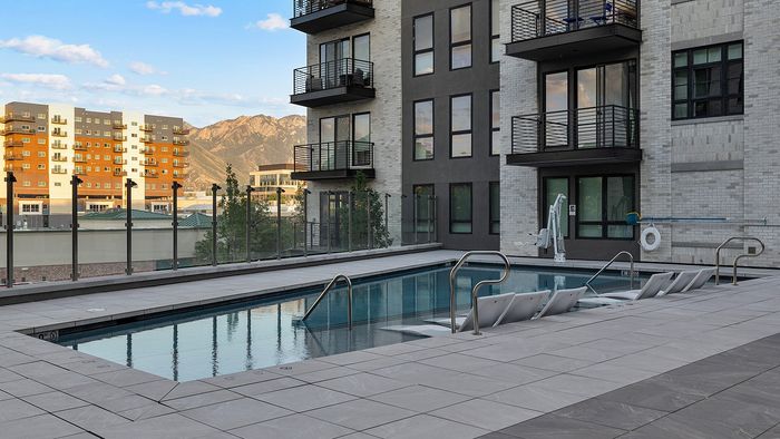 Resort-Style Pool Deck at Sugar Alley – side view of pool