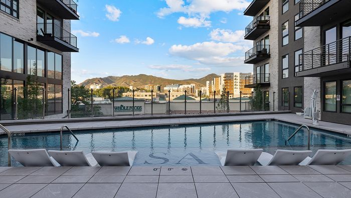 Resort-Style Pool Deck at Sugar Alley – pool with pool chairs