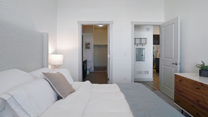 Merritt 1 bedroom apartment bedroom with ensuite bathroom access at Parkway Lofts in Orem Utah
