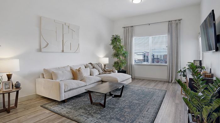 Merritt 1 bedroom apartment living area with open layout at Parkway Lofts in Orem Utah