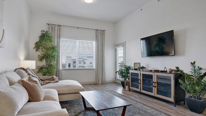 Merritt 1 bedroom apartment living room with natural light at Parkway Lofts in Orem Utah