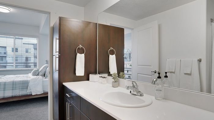 Palisades 2 bedroom apartment bathroom vanity with linen storage at Parkway Lofts in Orem Utah