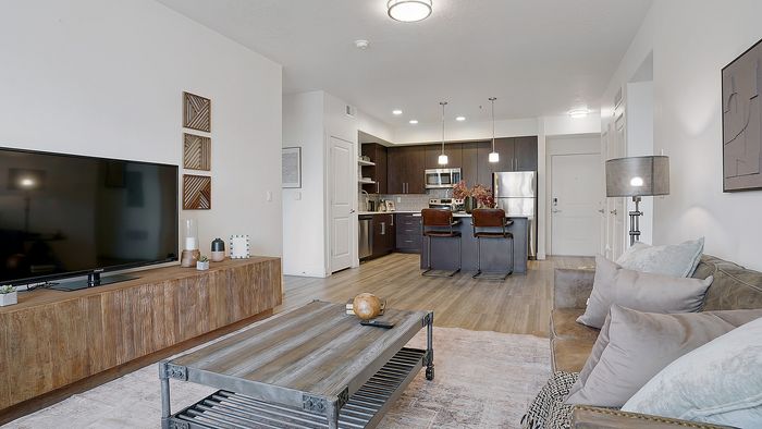 Palisades 2 bedroom apartment open living room and kitchen layout at Parkway Lofts in Orem Utah