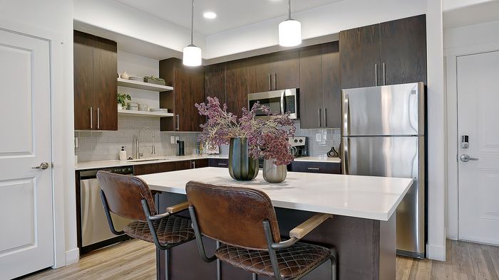 Palisades 2 bedroom apartment kitchen island with bar seating at Parkway Lofts in Orem Utah