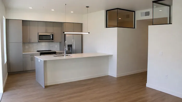 Stainless steel appliances and modern cabinetry in Aster two-bedroom kitchen at Silo Park