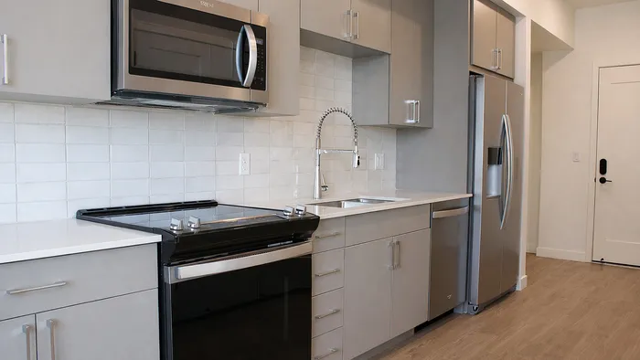 Compact modern kitchen with clean finishes in Bluebell studio at Silo Park