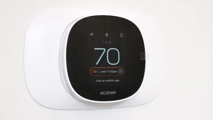 Smart thermostat with digital display inside apartment at Silo Park